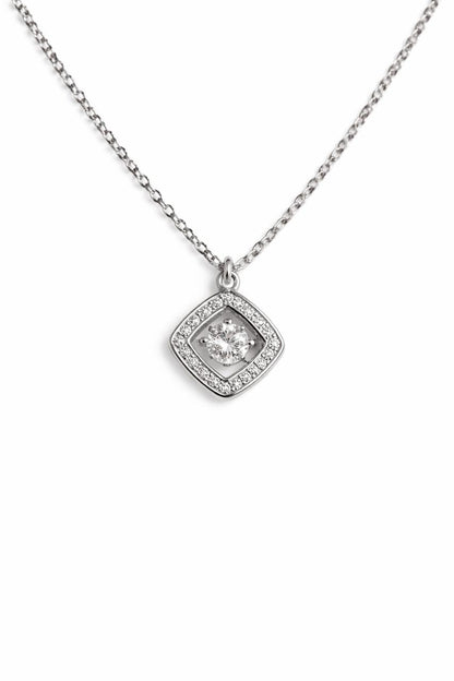 Close-up of silver square crystal pendant necklace with stone detailing